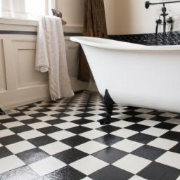 The classic black and white checkered tile floor adds timeless charm to this bathroom.