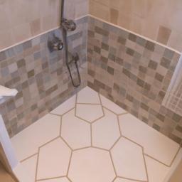 The stylish hexagonal tile floor adds visual interest to this minimalist bathroom.