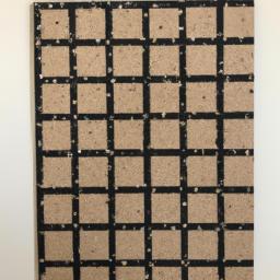Keep it simple and stylish with a minimalist black and white cork board.