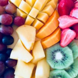 This fruit platter arranged in a rainbow pattern makes for a beautiful and healthy snack