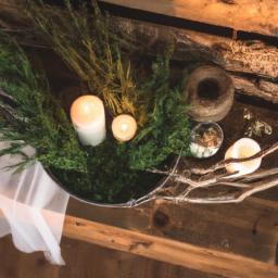 Create a cozy atmosphere with a rustic centerpiece featuring tree branches and candles.