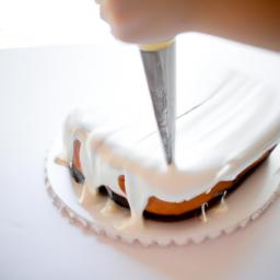 Spreading cake icing evenly on a cake is crucial for achieving a professional look