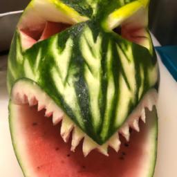 This watermelon shark is a unique and fun way to serve fruit at a party