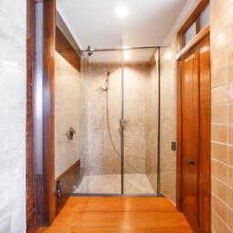 The wood-look tile floor adds warmth to this modern bathroom.