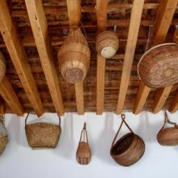 Bring a natural and rustic feel to your room with a collection of woven baskets on your vaulted ceiling wall